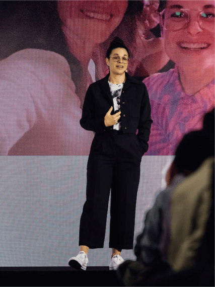 Ariel Levine presenting on stage